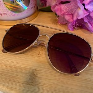 Rose gold sunglasses with pink lenses